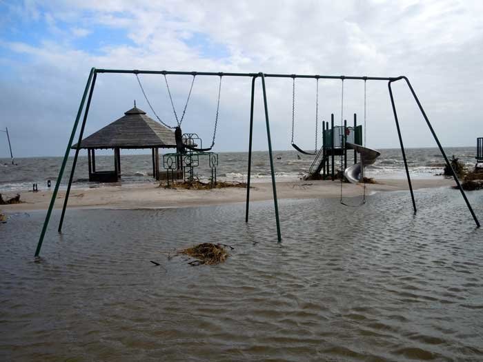 Pictured are photos from the storm’s aftermath in 2012, with heavy flooding impacting the playground and marina.